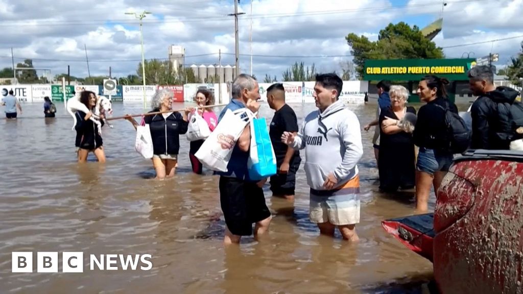 Residents flee homes in flooded Argentine city