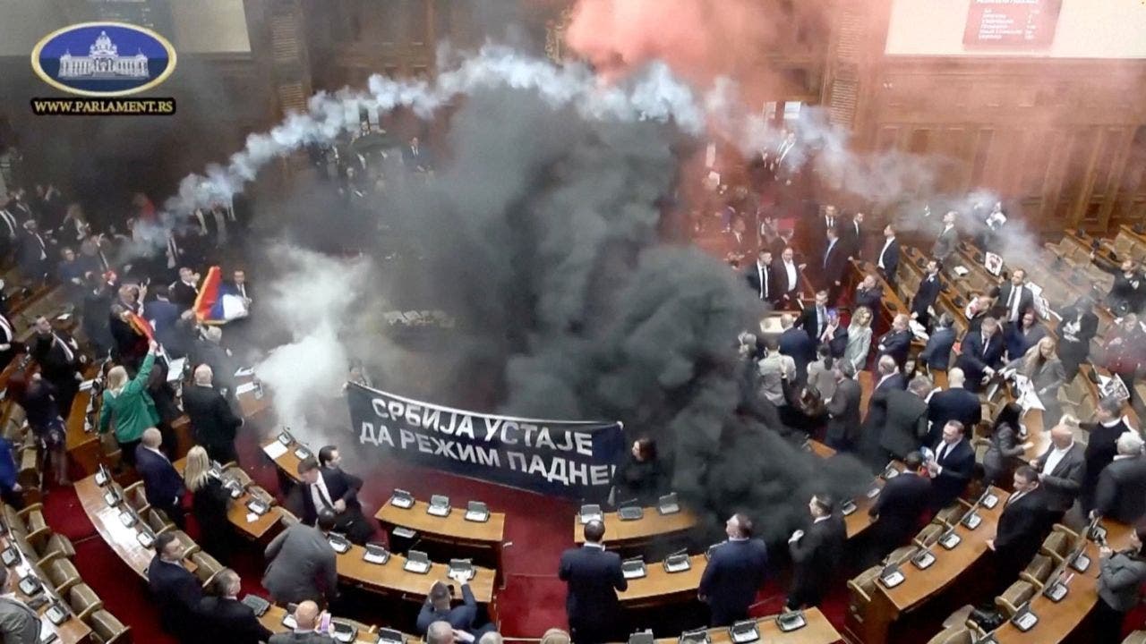 Serbian opposition lawmakers throw smoke grenades, tear gas in parliament