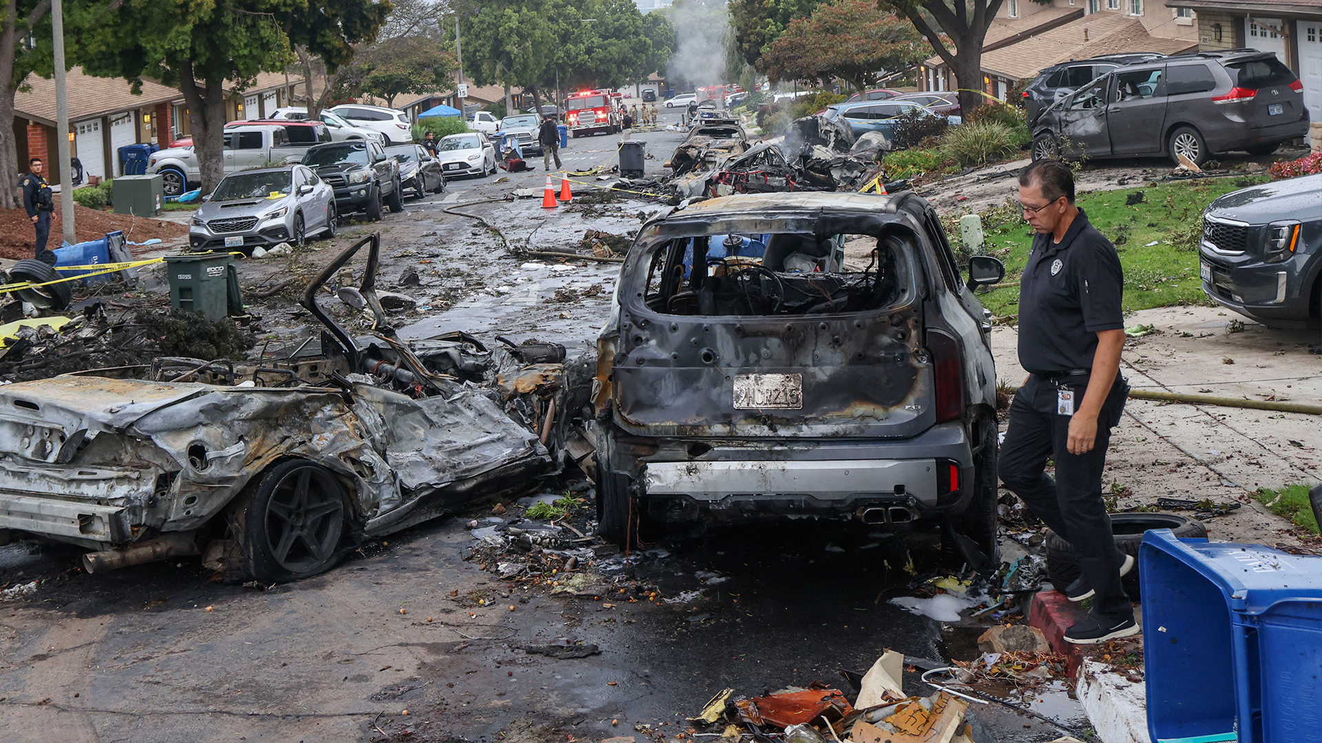 Damaged homes after small plane crashes into US neighbourhood